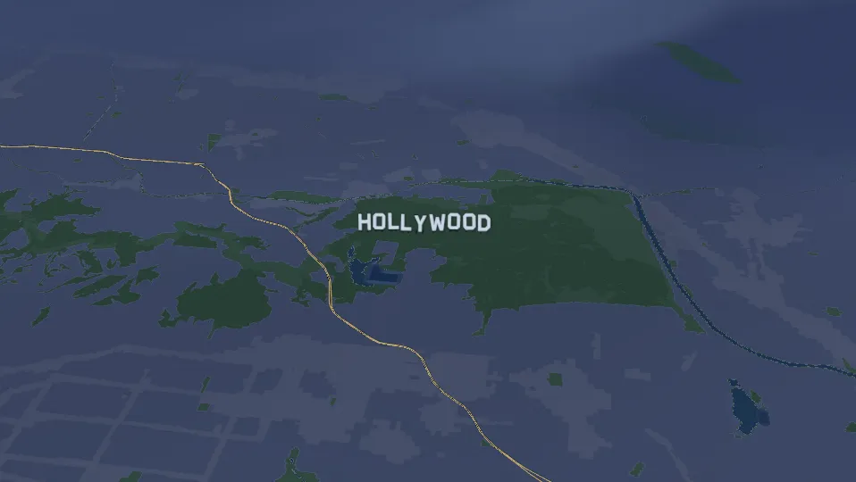 The Hollywood sign in the hills at night.